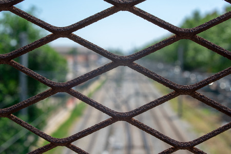 Iron fence with bokeh backgroundの写真素材