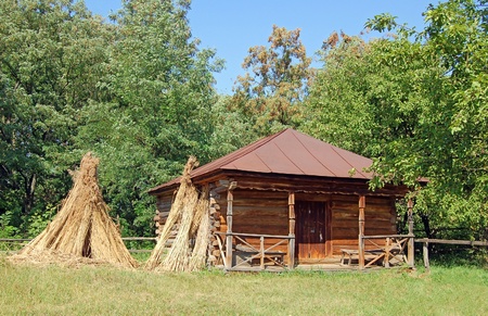 Ancient traditional ukrainian rural barn with a straw roofのeditorial素材