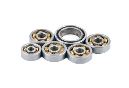 Old and dirty ball ball bearing, isolated on white background の写真素材