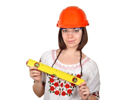 Smiling woman architect in Ukrainian blouse with gaugeの写真素材