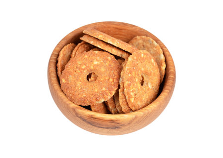 Cookie in wooden bowl, isolated on white background
