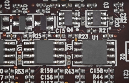 Close up of a printed brown computer circuit boardの写真素材