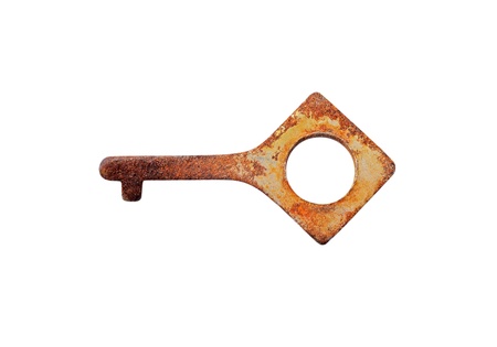 Vintage small rusty key, isolated on white backgroundの写真素材