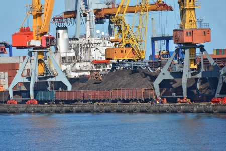 Cargo crane, freight traine and coal in portの写真素材