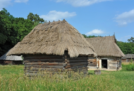 Ancient traditional ukrainian rural barn with a straw roofの写真素材