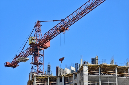 Concrete formwork and crane on construction siteの写真素材