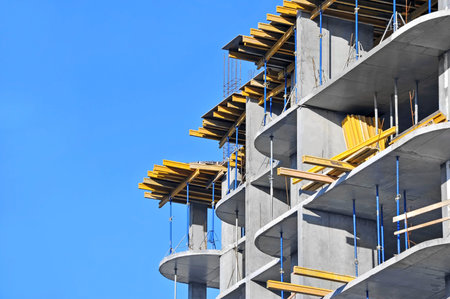 Building construction site work against blue sky