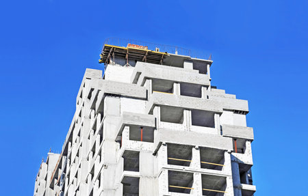 Building construction site work against blue sky