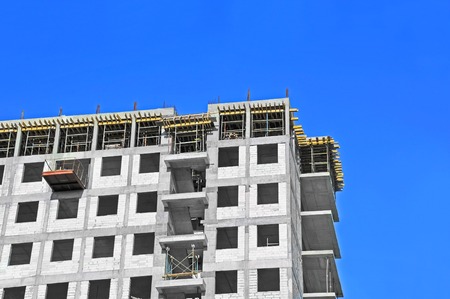 Building construction site work against blue skyの写真素材