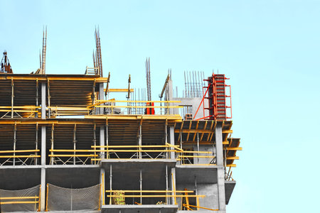 Building construction site work against blue sky