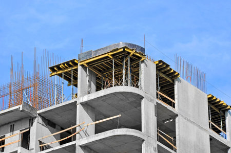 Building construction site work against blue sky