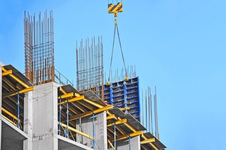 Building construction site work against blue sky