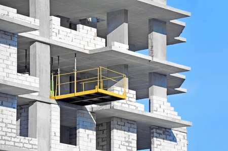 Building construction site work against blue skyの写真素材