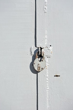 Rusty vintage lock on old garage gateの写真素材