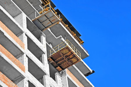 Building construction site work against blue sky