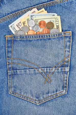 Money, coin and dollars in jeans pocketの写真素材