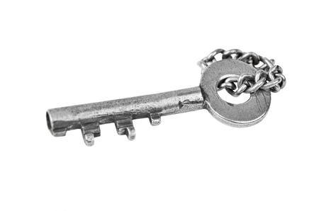 Vintage rusty key with chain, isolated on white backgroundの写真素材