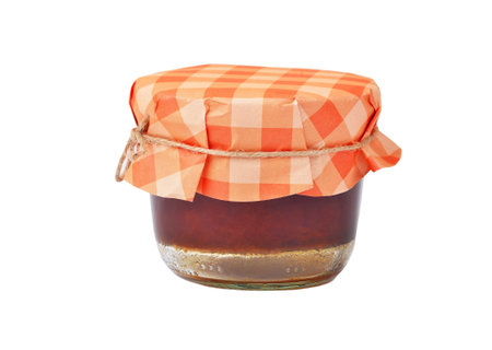 Apricot jam in glass jar, isolated on white backgroundの写真素材