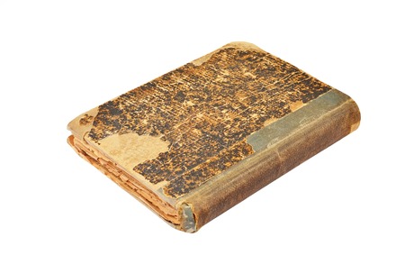 Dirty antique book, isolated on white backgroundの写真素材