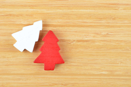 Decorative Christmas fir tree on natural wooden backgroundの写真素材