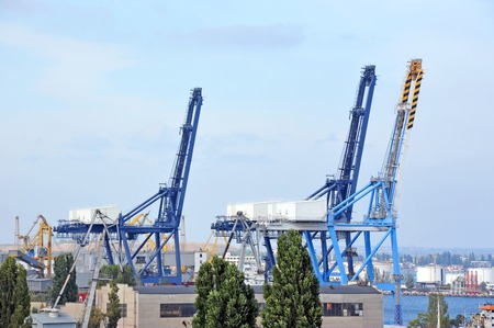 Port cargo crane over blue sky backgroundの写真素材
