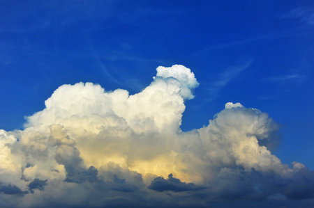 Blue sky background with fluffy white clouds