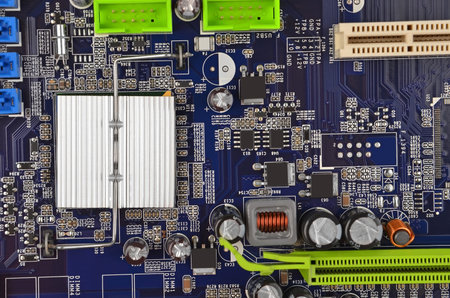 Blue printed computer motherboard with microcircuit, close-up