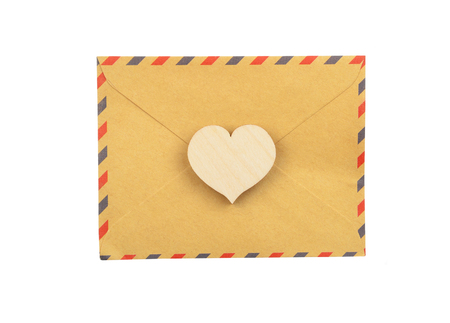 Envelope and heart, isolated on white backgroundの写真素材