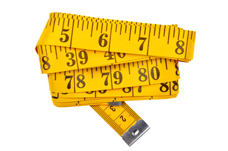 Yellow measuring tape, isolated on white background