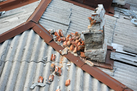 Broken ventilation duct from brick on roof