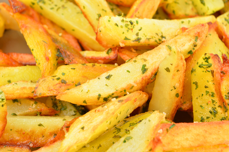 Tasty fried potato with herb, close upの写真素材