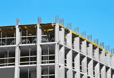 Building construction site work against blue sky