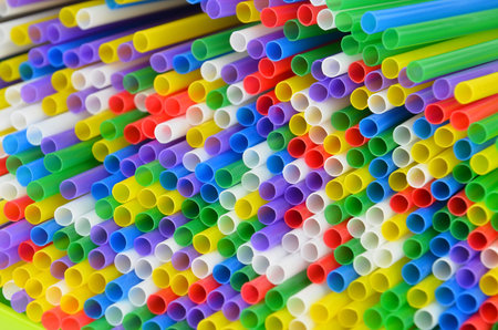 Colorful plastic drinking straws, close up as background