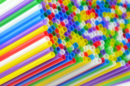 Colorful plastic drinking straws, close up as background