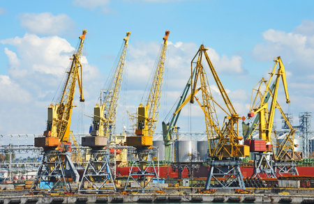Port cargo crane over blue sky backgroundの写真素材