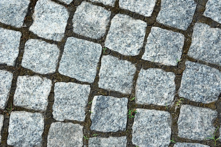 Old paving stone background on city street
