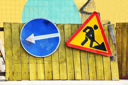 Sign and fence on road construction workの写真素材