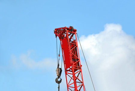 Mobile construction tower crane against blue sky