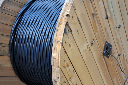 Wooden coil of electric cable on construction site