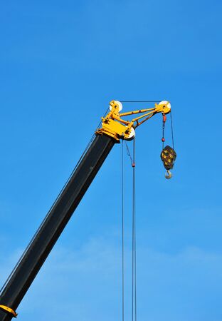 Mobile construction tower crane against blue skyの写真素材