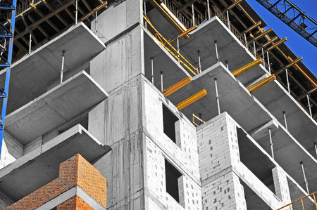 Building construction site work from concrete and brick