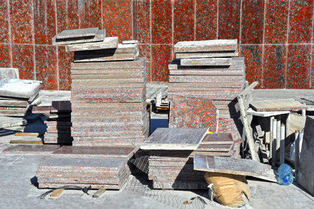 Faced granite tile on building construction site