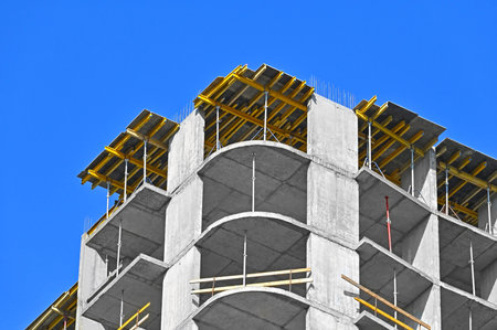 High-rise building construction site work with scaffolding