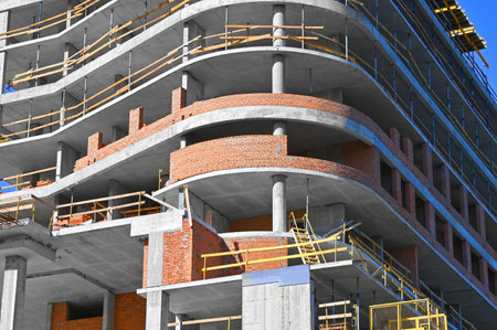 Building construction site work from concrete and brick