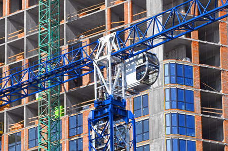 Crane and building from concrete and brickの写真素材