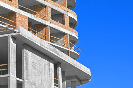 High-rise building construction site work with scaffolding