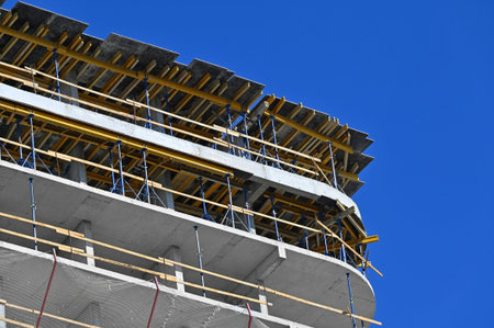 High-rise building construction site work with scaffolding