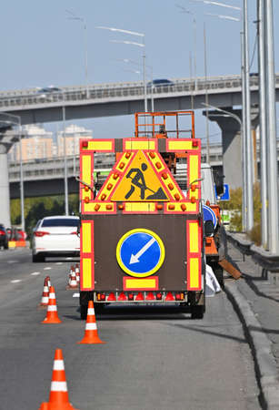 Sign and fence on road construction workの写真素材