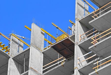 High-rise building construction site work with scaffolding