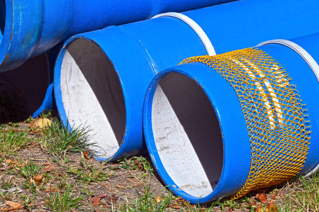 Ceramic sewer pipe stacked on construction site